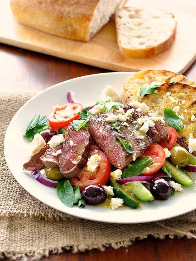 Greek Lamb and Salad Dinner on a white plate
