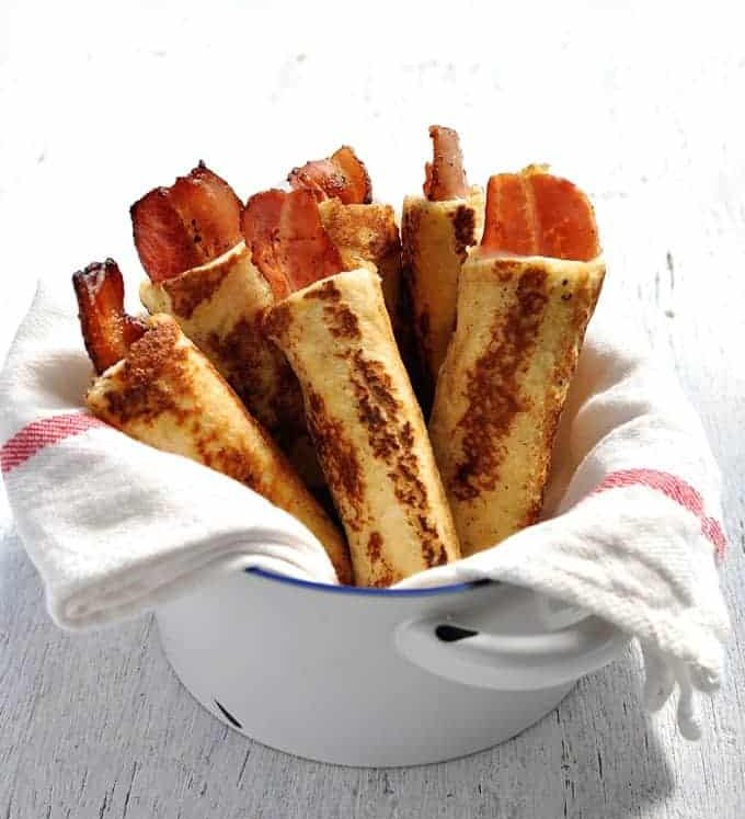 Bacon French Toast Roll Ups - crispy bacon rolled up in bread, dipped in egg mixture and pan fried golden brown. These need to be made with fresh, plain sandwich bread, not fancy artisan bread. #breakfast #brunch #french_toast #bacon #roll_up