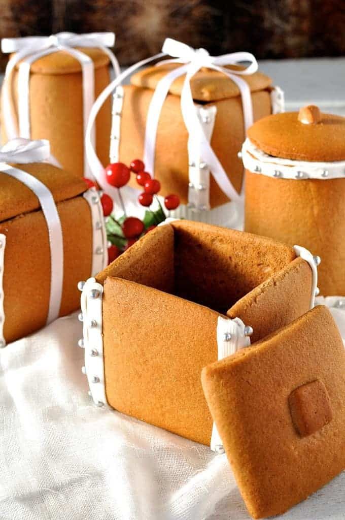 Festive spread of Gingerbread Boxes and Mason Jars tied with ribbons and filled with chocolate truffle balls.
