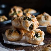 A pile of Ricotta and Spinach Puff Pastry Bites