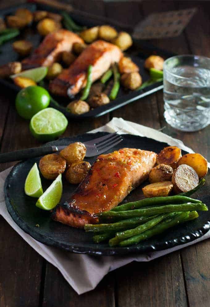 A plate of Chili Lime Baked Salmon with Potatoes and Beans (One Tray Meal)