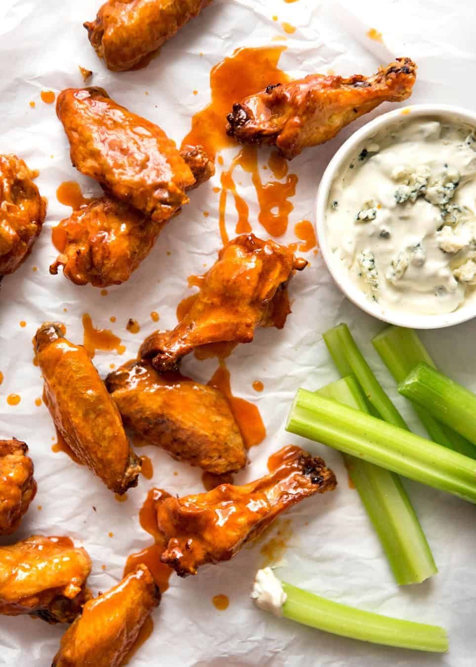 Truly Crispy Oven Baked Buffalo Wings - no false promises here, these wings are seriously crispy and unbelievably easy to make. Tossed in a classic Buffalo Sauce and served with blue cheese sauce. Watch the recipe video to HEAR just how crispy these are! recipetineats.com