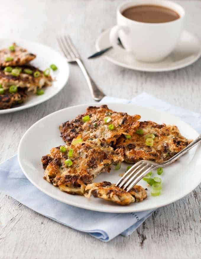 Crispy Cheesy Sausage Hash Browns on a plate, ready to be eaten.