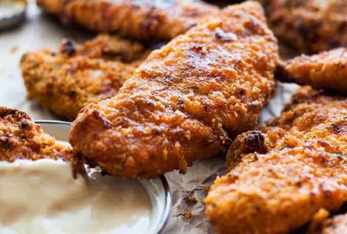 Oven Fried Chicken Tenders - tastes just like KFC, with a crunchy coating, 11 Secret Herbs & Spices and a fraction of the calories! recipetineats.com