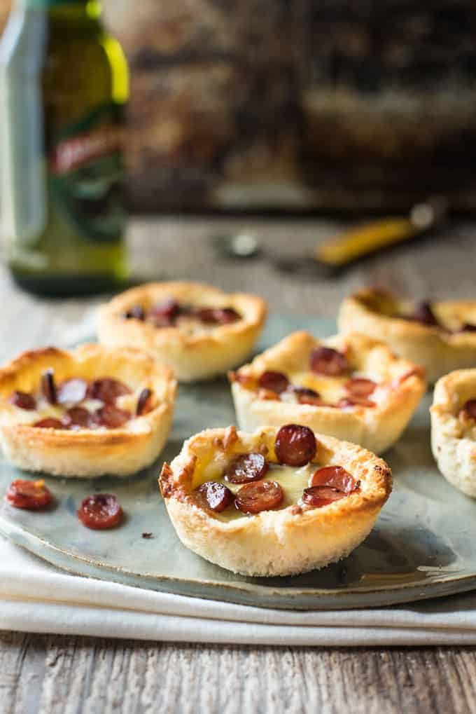 Garlic Bread Mini Pizza - made from plain sandwich bread brushed with garlic butter, these mini pizzas taste like a cross between garlic bread and pizza!