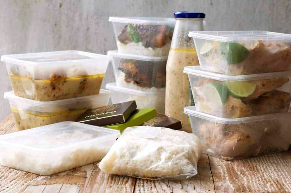 Leftovers packed in boxes for pot roasted coconut chicken