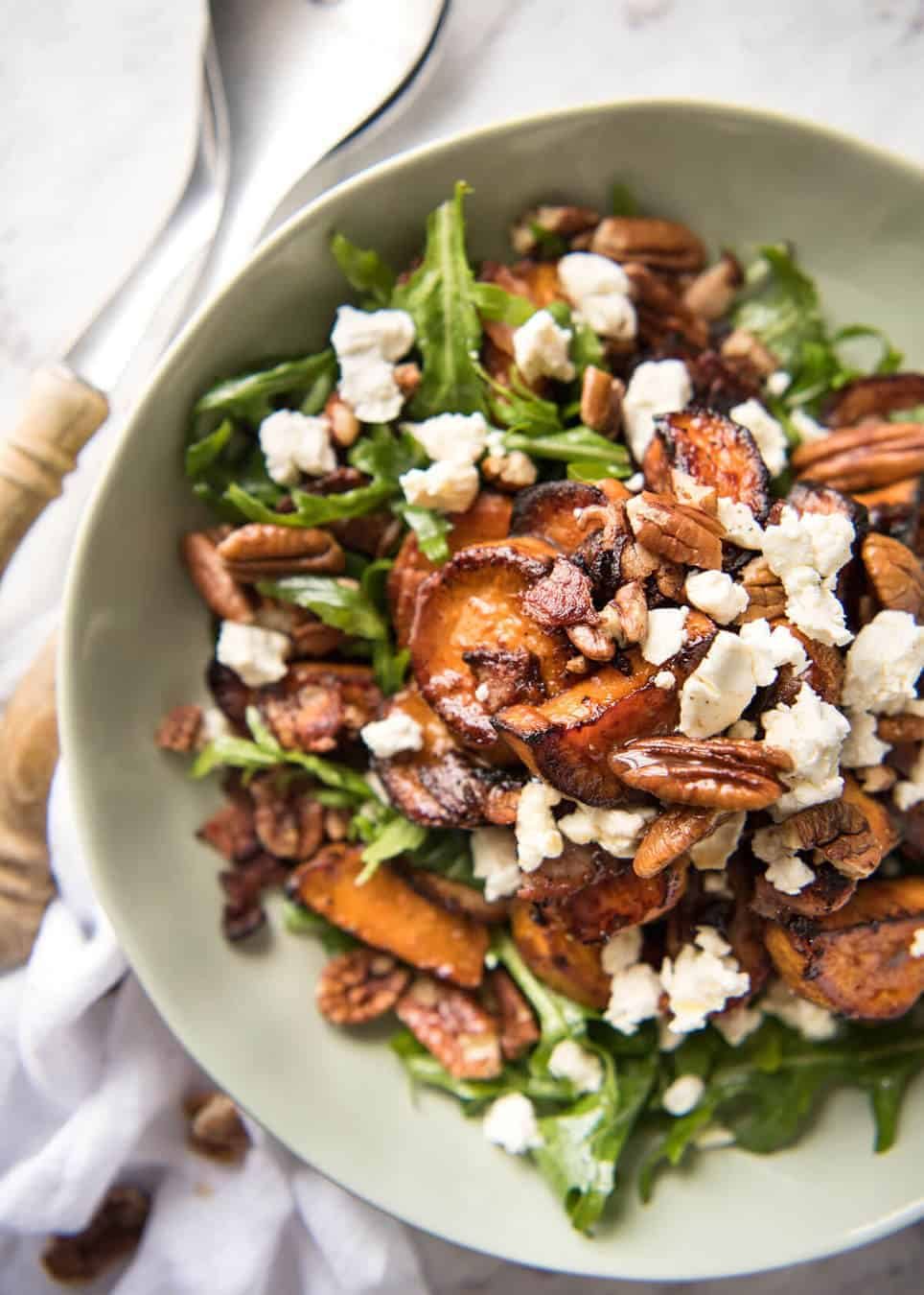 Roasted Sweet Potato Salad - with arugula/rocket, pecans, goats cheese or feta, a sprinkle of bacon and a beautiful Honey Lemon dressing. recipetineats.com