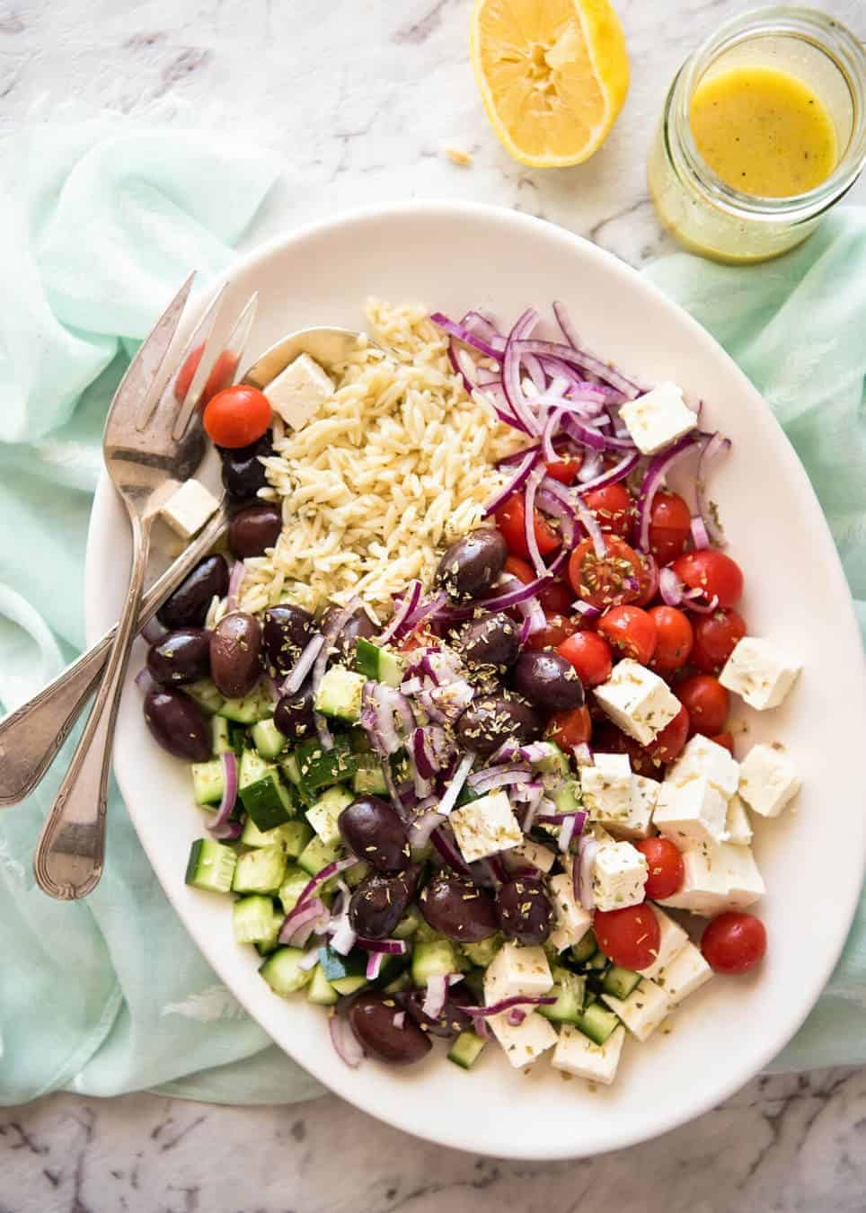Greek Lemon Orzo Salad (Risoni) - All the fixings of a Greek Salad tossed through orzo / risoni and dressed with a gorgeous zesty lemon vinaigrette. recipetineats.com