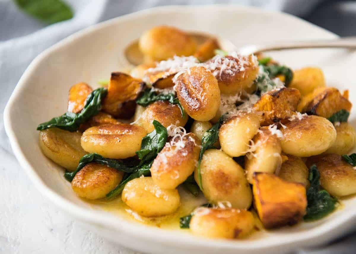 Pan Fried Gnocchi with Pumpkin and Spinach - Golden crispy on the outside, soft on the inside, with a butter sage sauce, roasted pumpkin and spinach. www.recipetineats.com