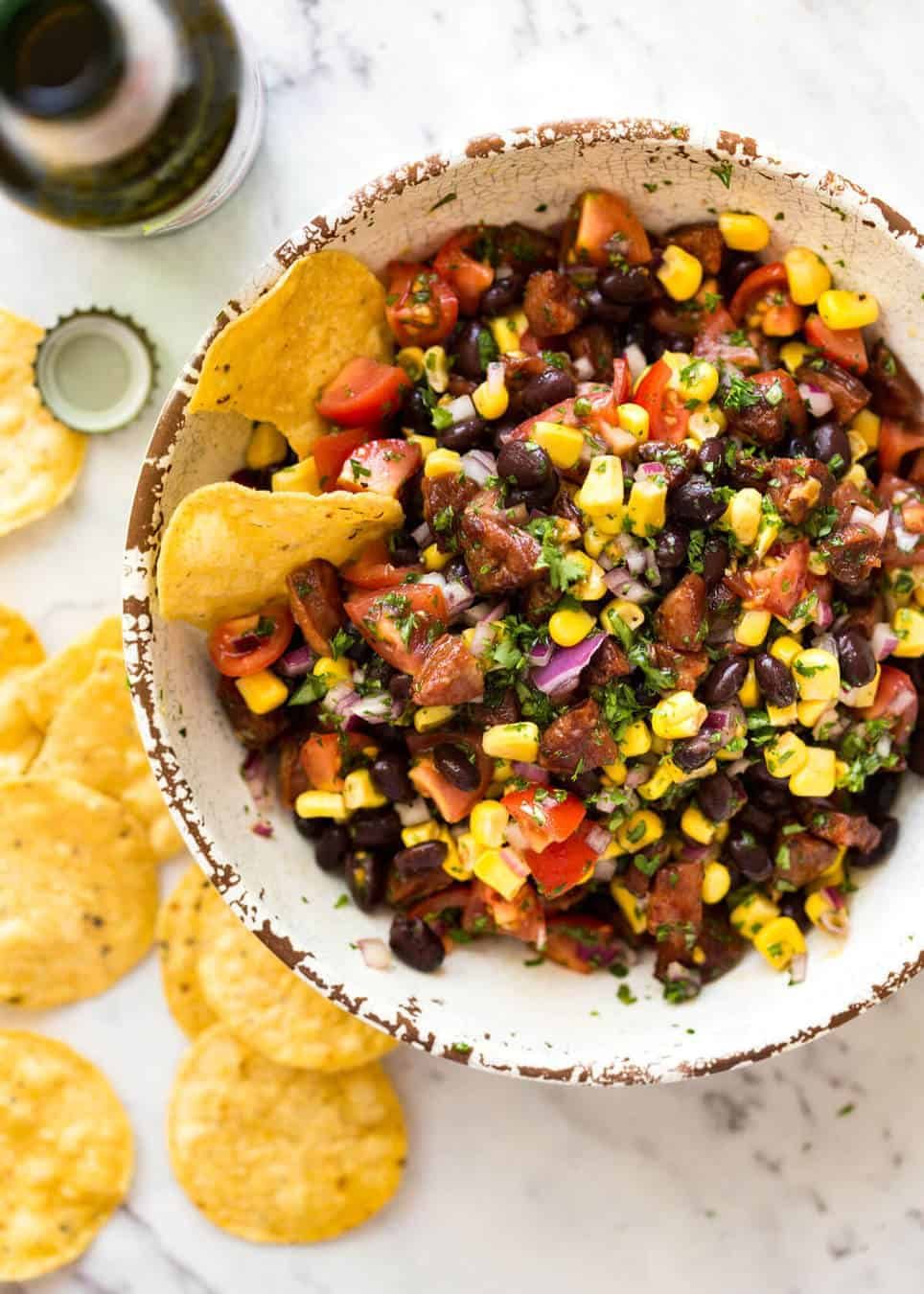 I call this a PIG OUT Salsa. Sensible people would call it an Chorizo, Black Bean and Corn Salsa. :) recipetineats.com