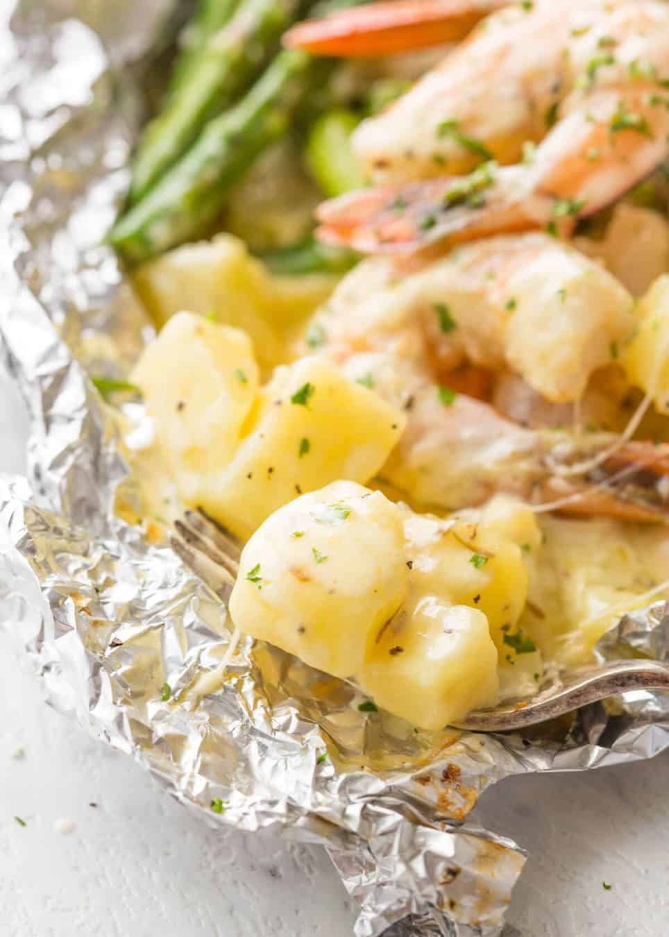 Creamy Garlic Shrimp, Cheesy Potatoes and asparagus - serious contender for the BEST foil packet recipe ever! recipetineats.com