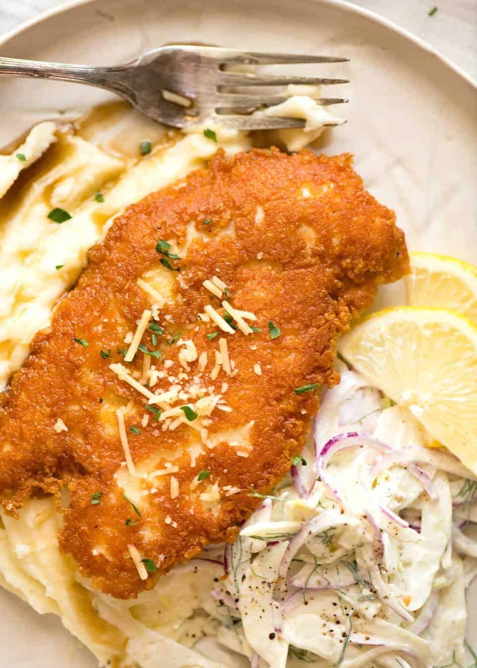 Parmesan Crusted Chicken Breast - golden brown and crispy on the outside, juicy on the inside.
