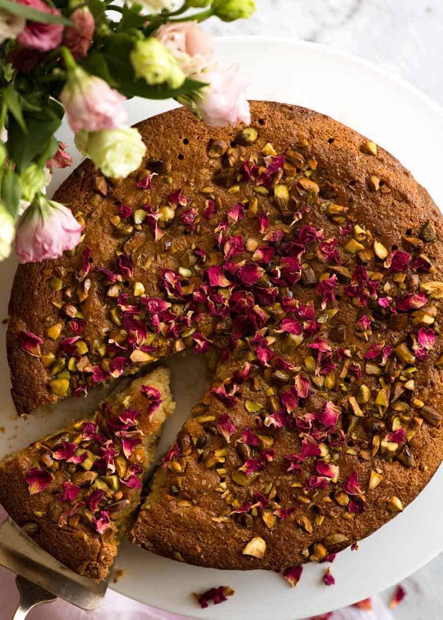 A beautiful Persian Love Cake that happens to be gluten free, made with semolina and almond meal. The best part is pouring the syrup over the cake so it soaks all the way through!