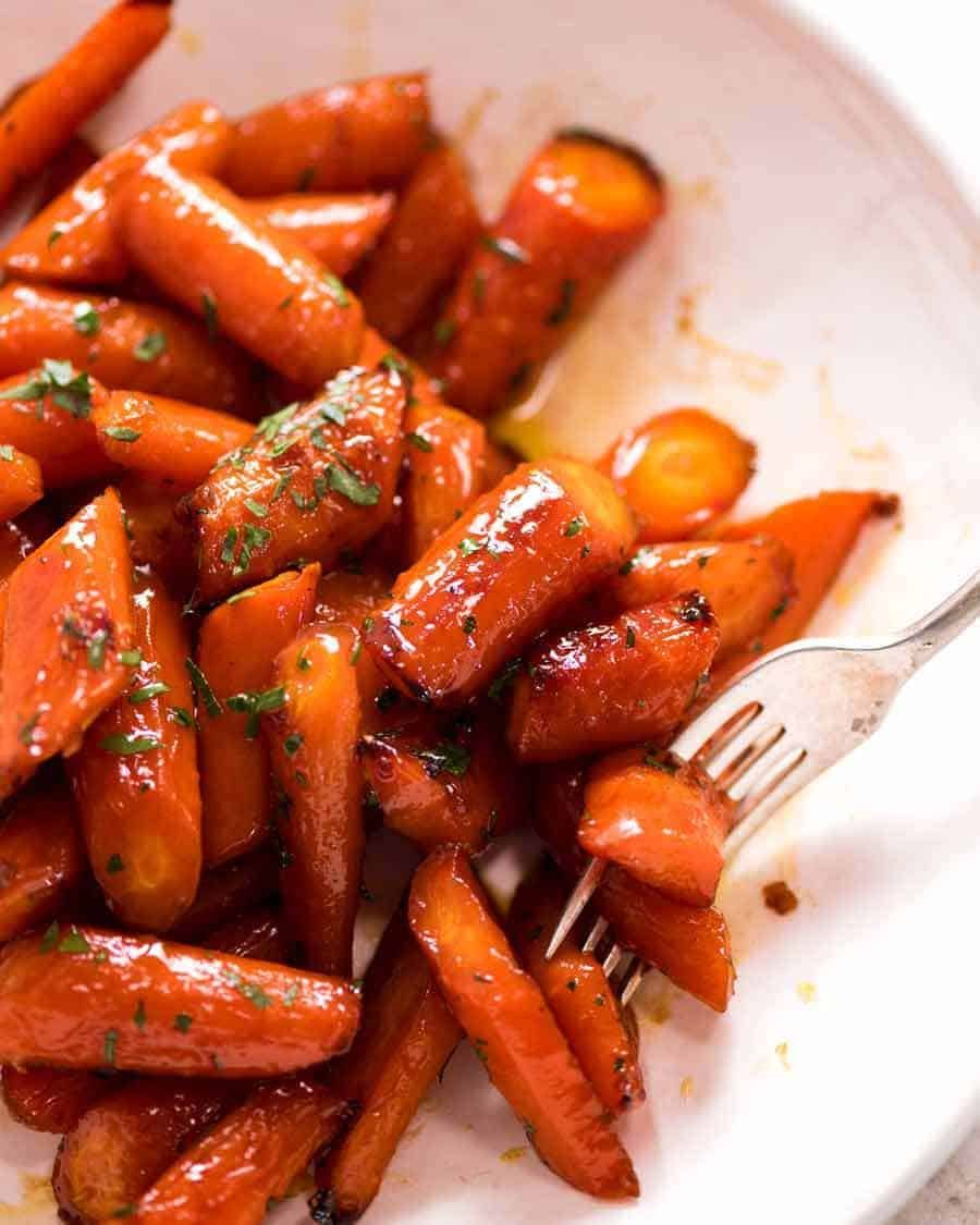 Brown Sugar Glazed Carrots in a white dish, ready to be served
