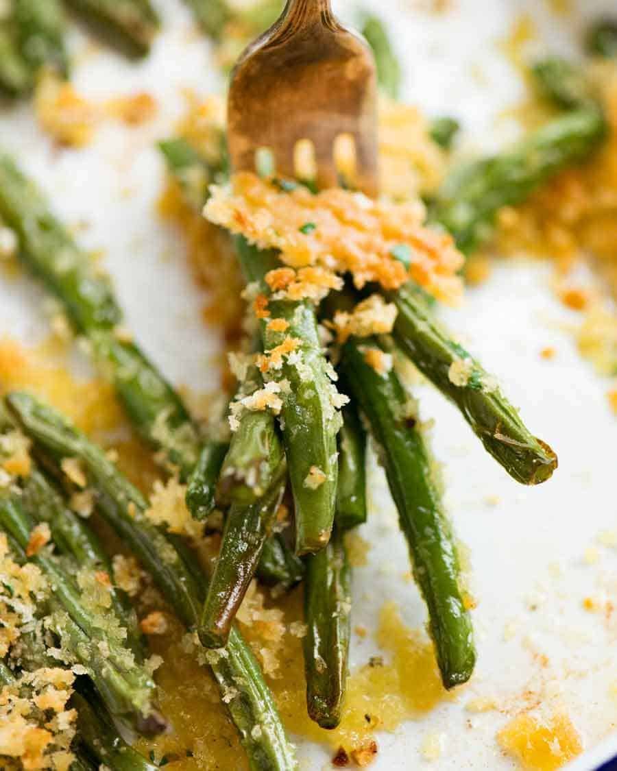 Close up of fork with Parmesan Roasted Green Beans