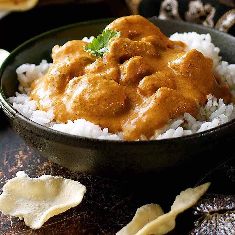 Butter Chicken served over basmati rice in a bowl, ready to be served