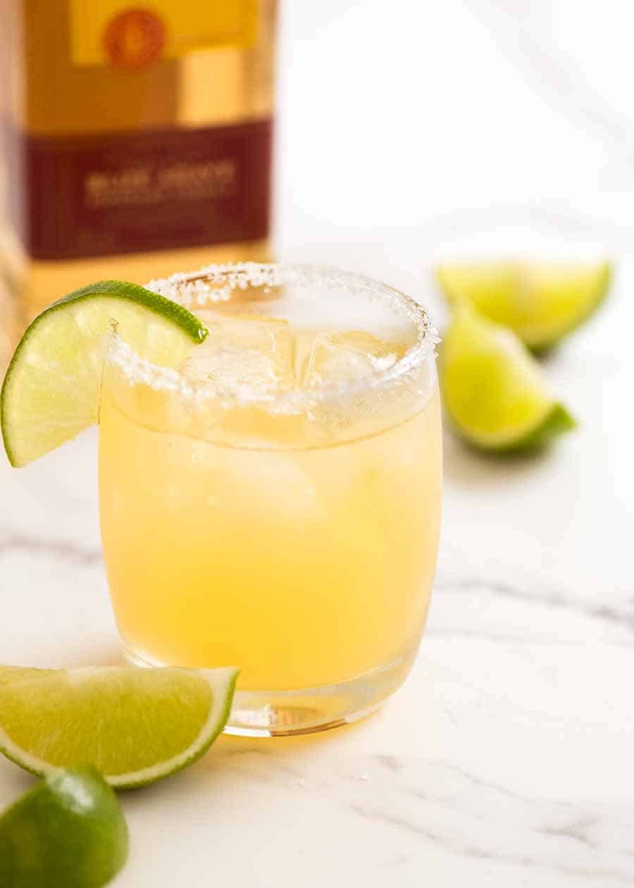 Skinny Margarita in a glass with ice, salt on the rim and lime wedge