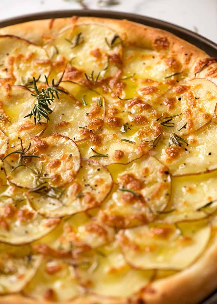 Potato Rosemary Pizza in a pizza pan, fresh out of the oven
