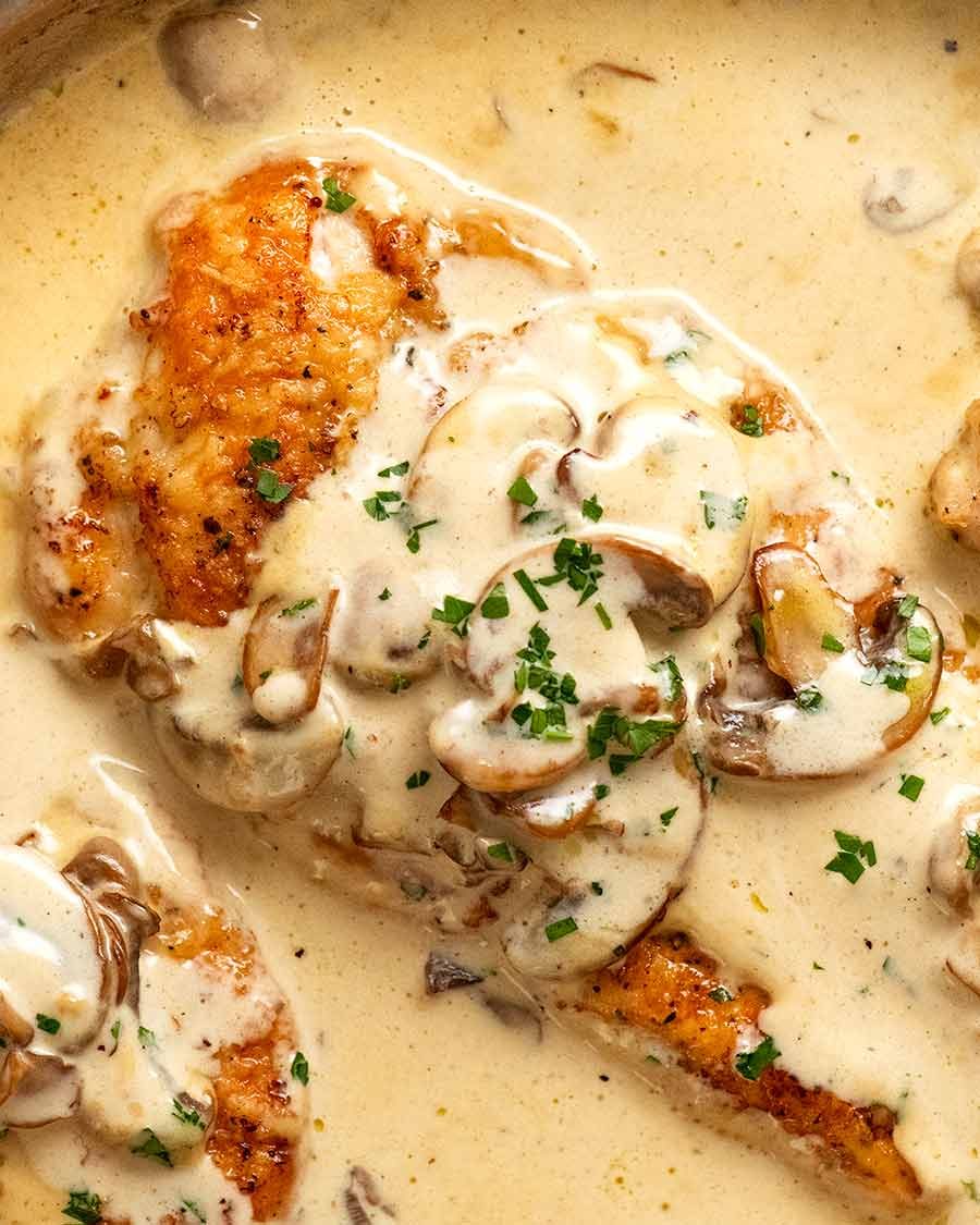 Close up of Chicken Breast in Creamy Mushroom sauce in a skillet, fresh off the stove