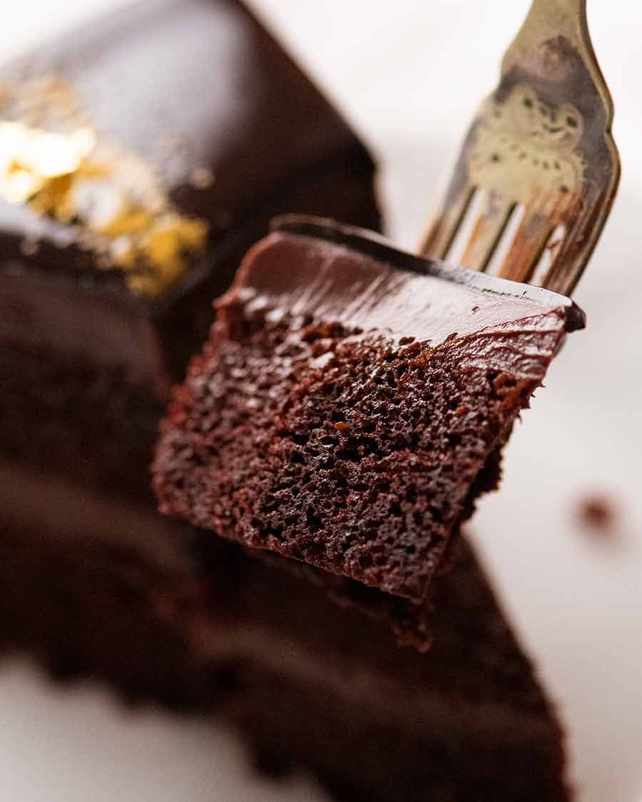 Eating Chocolate Mirror Glaze Cake with fork