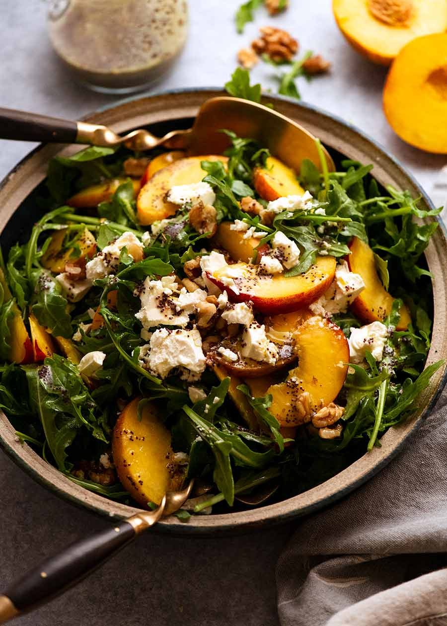 Peach Salad with Poppyseed Dressing in a bowl, ready to be served