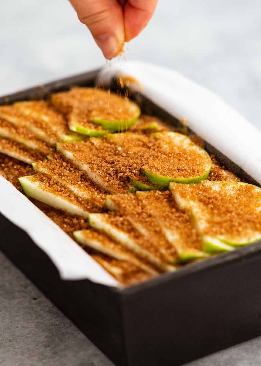 Sprinkling sugar on Cinnamon Apple Bread