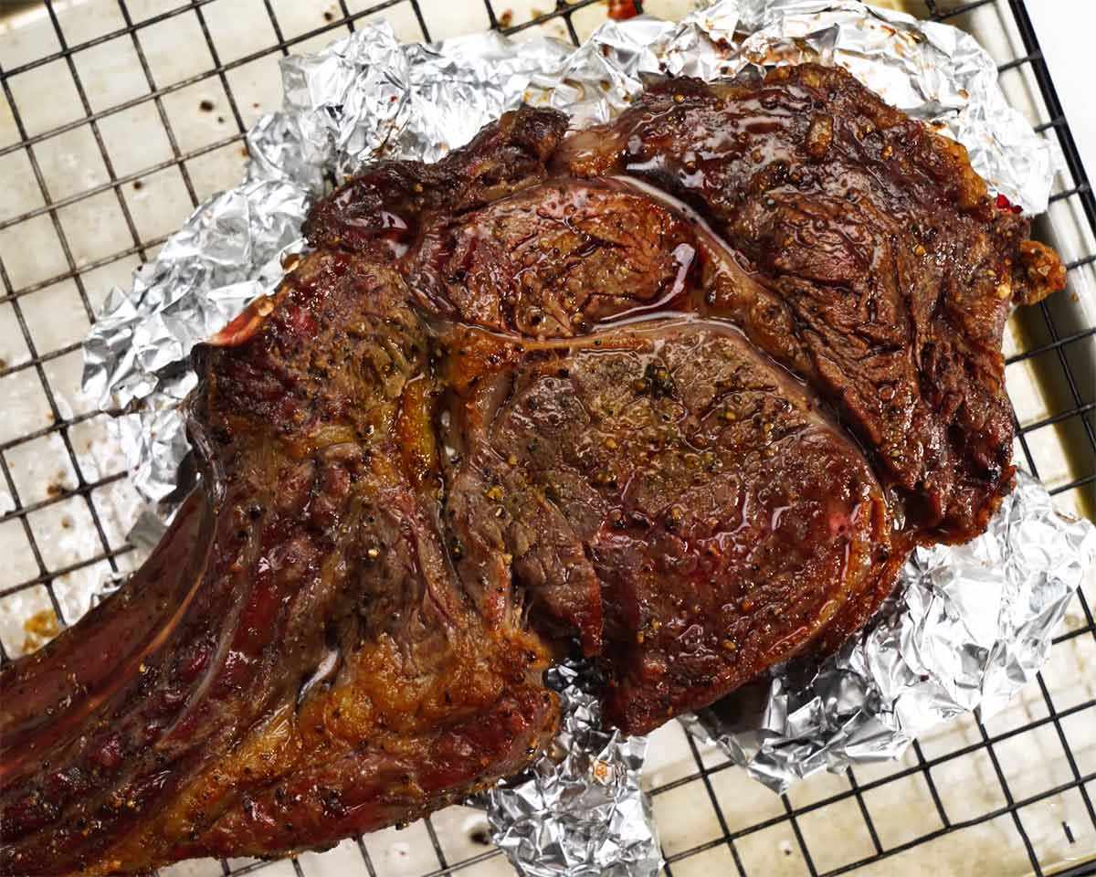 Tomahawk steak cooked in oven grill / broiler